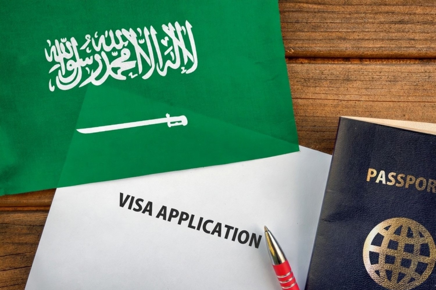 stock photo visa application form passport and flag of saudi arabia 2223683879 1